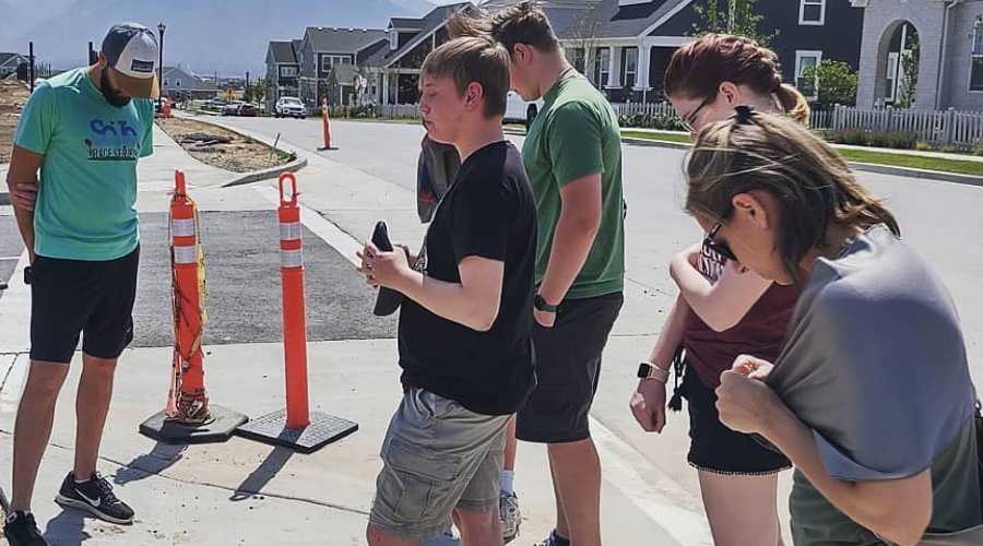 Neighborhood Church praying on sidewalk