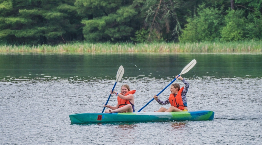 Girls canoeing at Trout Lake Camp