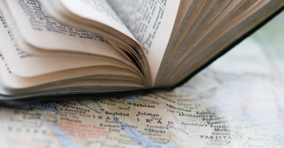 Bible on top of map of Iran
